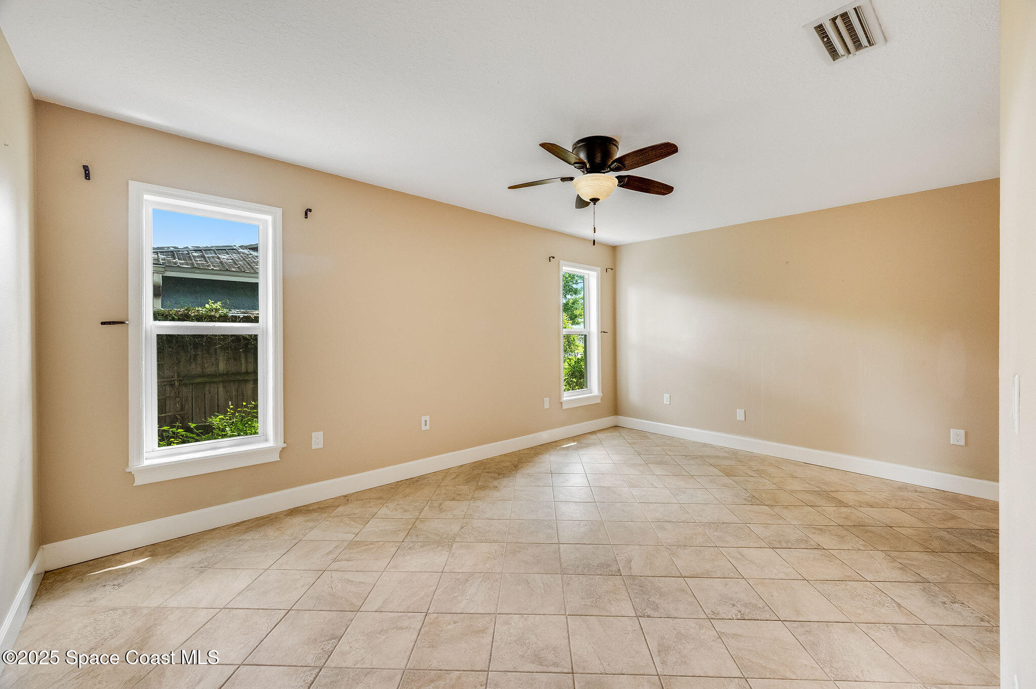 7081 Bayfront Road Cocoa, FL 32927 - Photo 9 of 45 a view of an empty room with a window