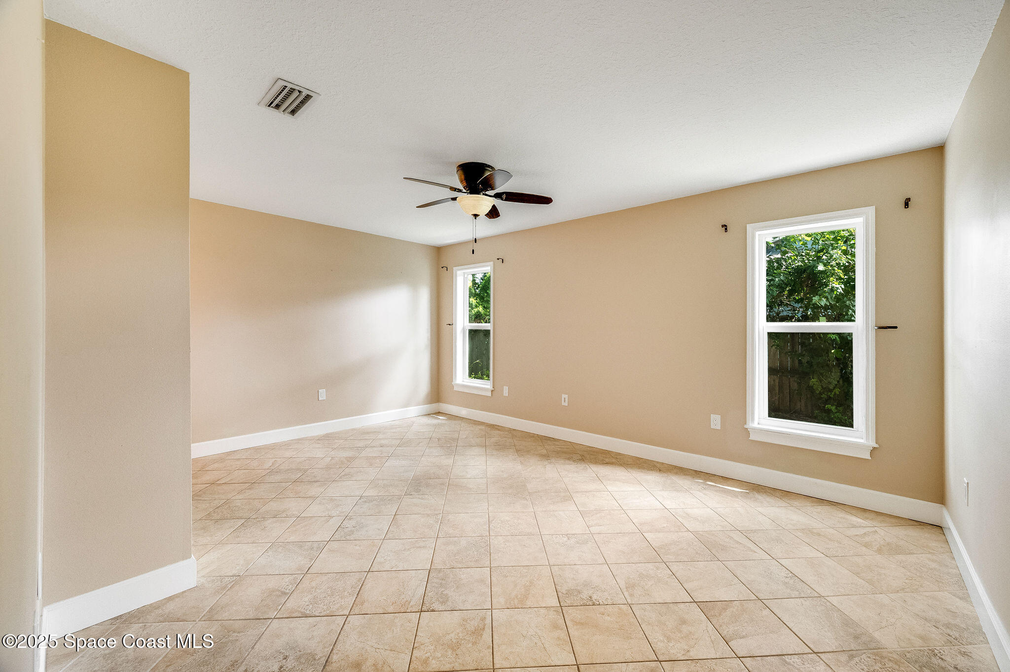 7081 Bayfront Road Cocoa, FL 32927 - Photo 10 of 45 a view of an empty room with a window