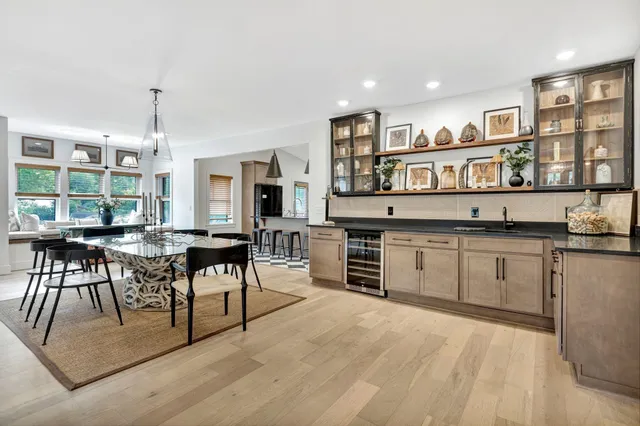a kitchen with stainless steel appliances granite countertop a stove and cabinets
