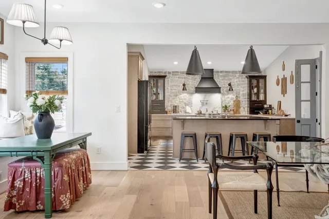 a kitchen with stainless steel appliances a sink a stove a refrigerator and cabinets