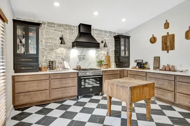 a kitchen with a stove a sink and a refrigerator