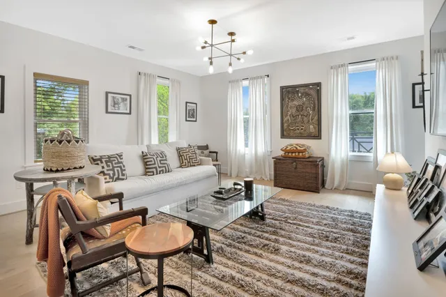 a bedroom with a bed and a lamp on table