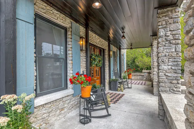 a outdoor living space with patio furniture and potted plants