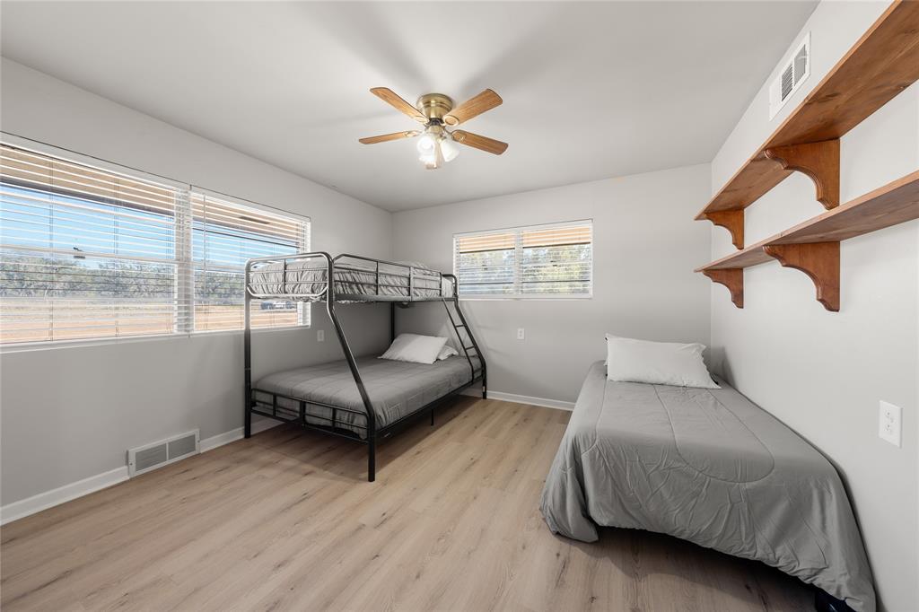 10652 Corbell Road Brady, TX 76825 - Photo 12 of 38 a living room with furniture and a floor to ceiling window