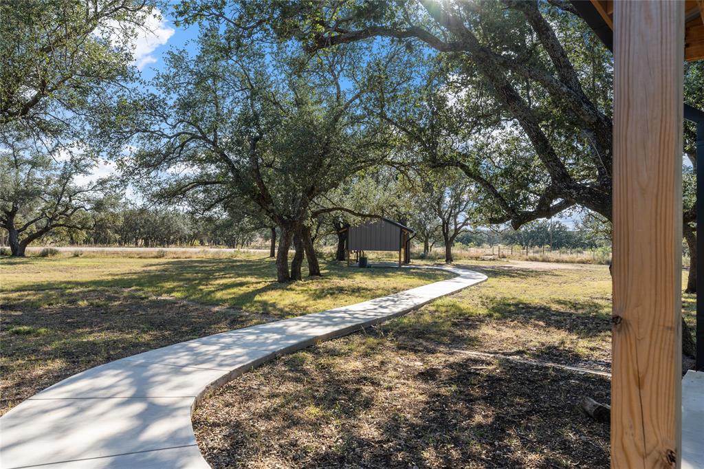 10652 Corbell Road Brady, TX 76825 - Photo 15 of 38 a view of a yard with large tree