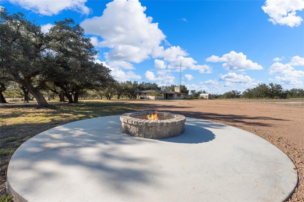 10652 Corbell Road Brady, TX 76825 - Photo 19 of 38 a view of a swimming pool with an ocean in the background