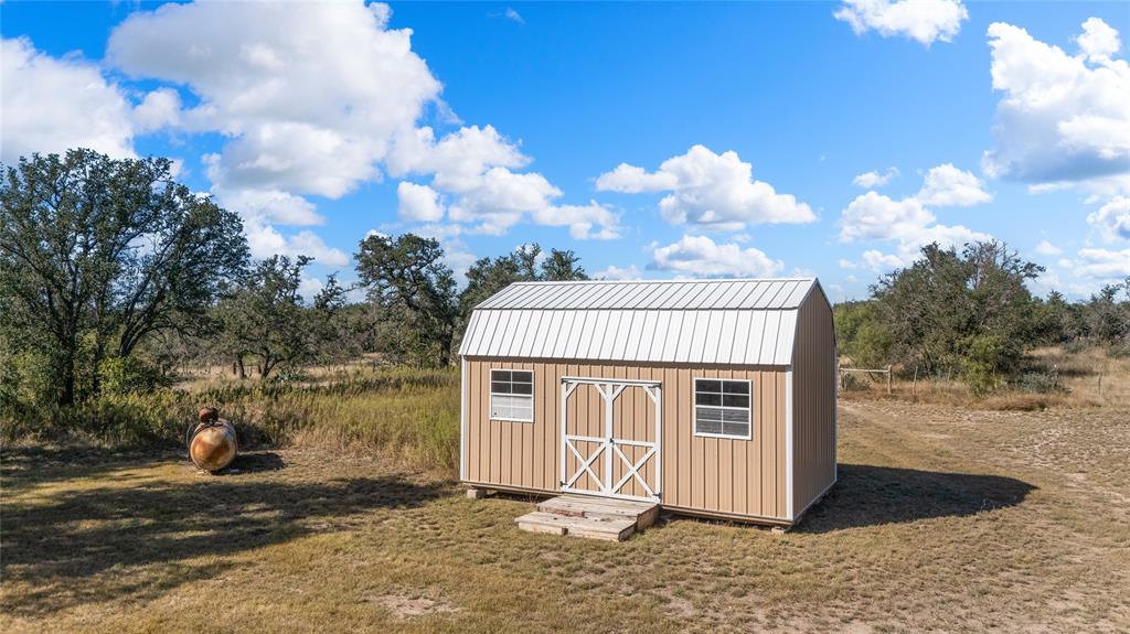 10652 Corbell Road Brady, TX 76825 - Photo 20 of 38 a front view of a house with a yard