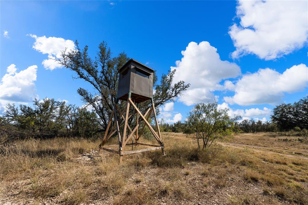 10652 Corbell Road Brady, TX 76825 - Photo 28 of 38 a view of a house with a yard and a fountain