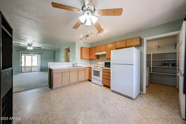 a kitchen with a refrigerator a sink and dishwasher