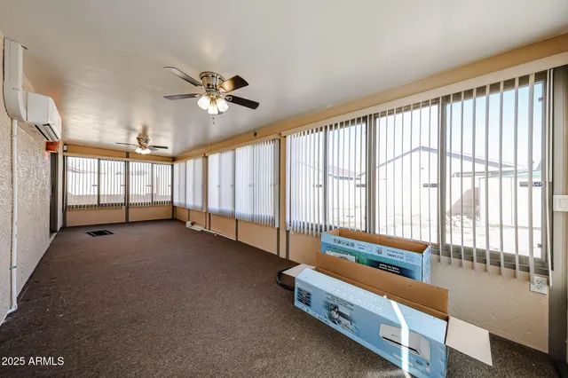 a bed room with a bed and a television