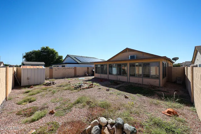 a view of a house with a snow in the background