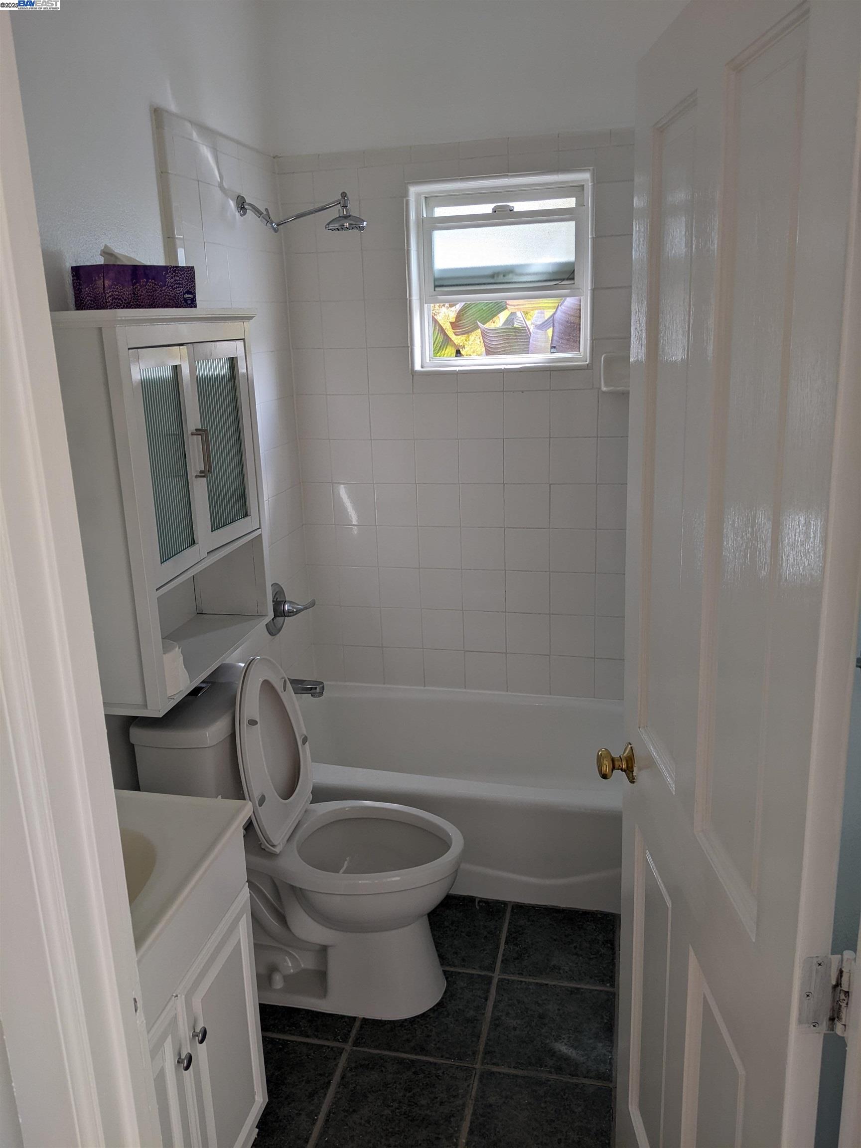 2622 Kingsland Avenue Oakland, CA 94619 - Photo 18 of 29 a bathroom with a toilet and a shower