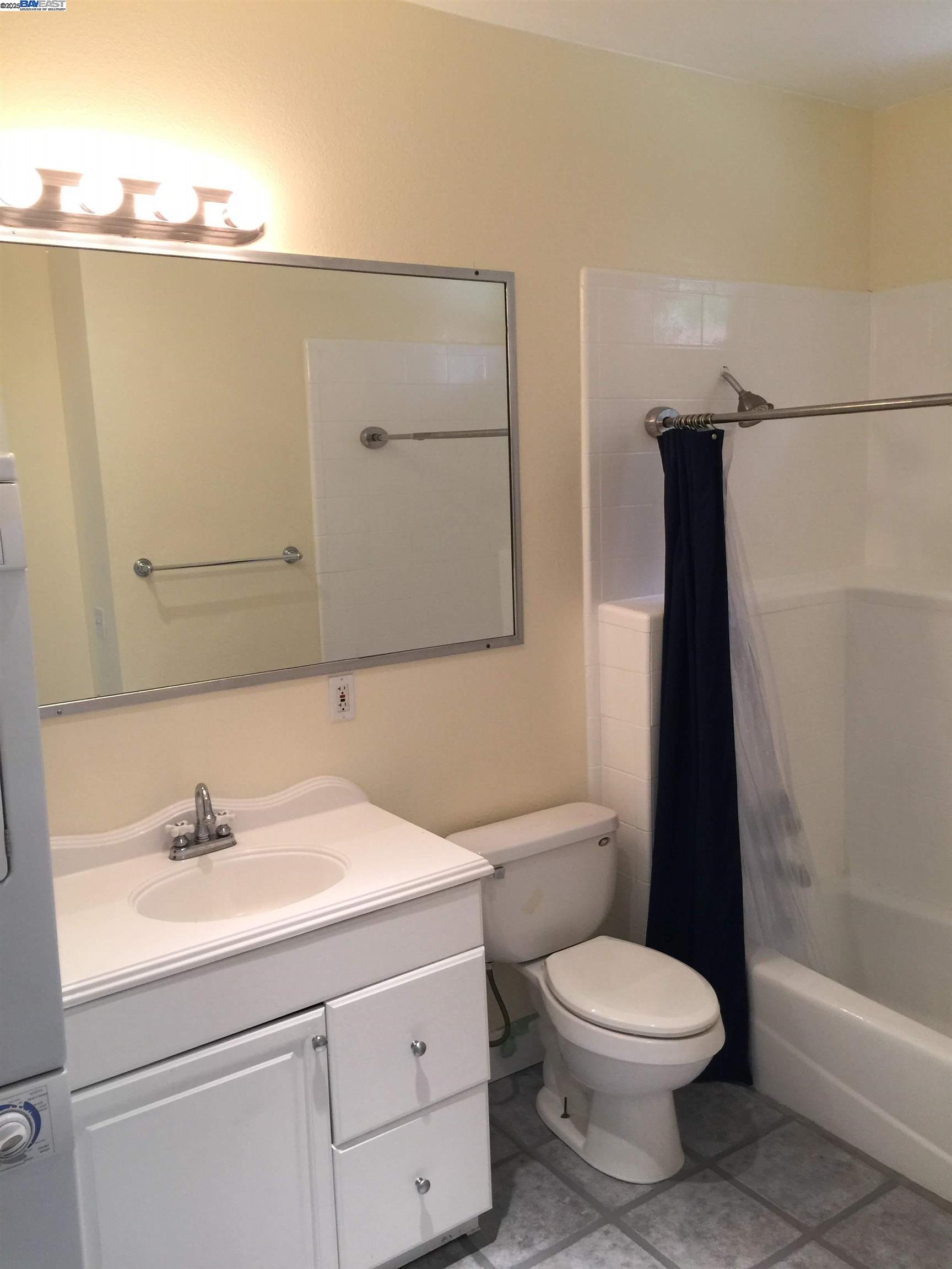 2622 Kingsland Avenue Oakland, CA 94619 - Photo 7 of 29 a bathroom with a sink a toilet and shower