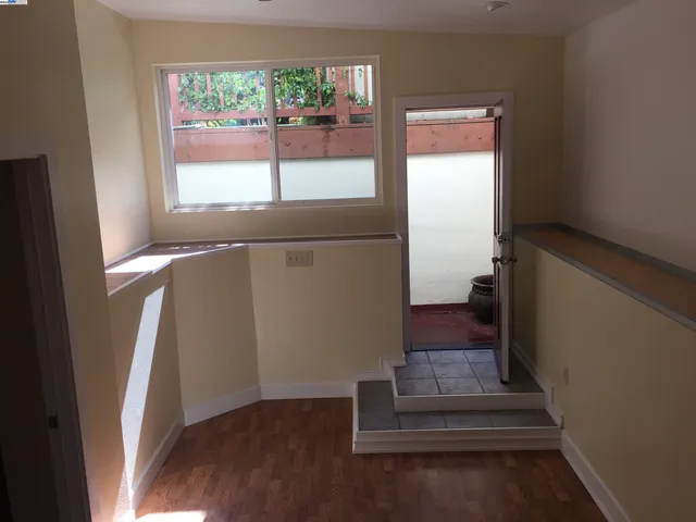 a bathroom with a bathtub and a window
