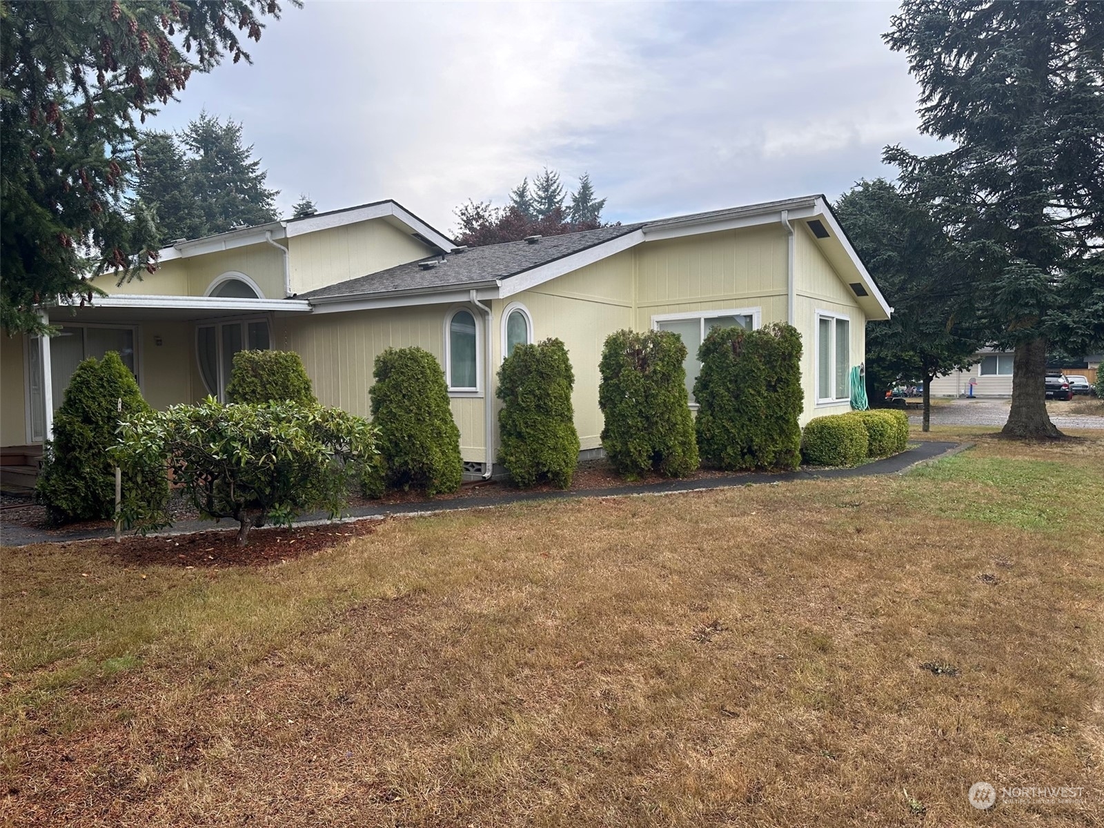 17727 Cyrus Lane Southwest Rochester, WA 98579 - Photo 3 of 12 a view of a house with a yard and plants
