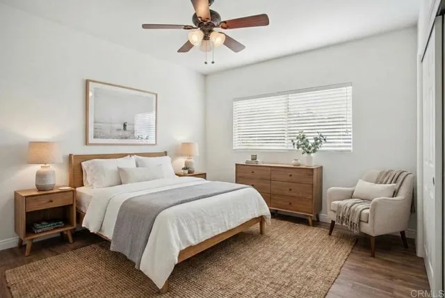 a bedroom with a bed and a couch