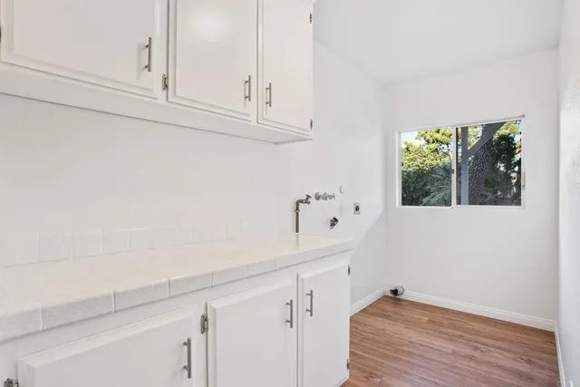 a view of cabinets with wooden floor and cabinet