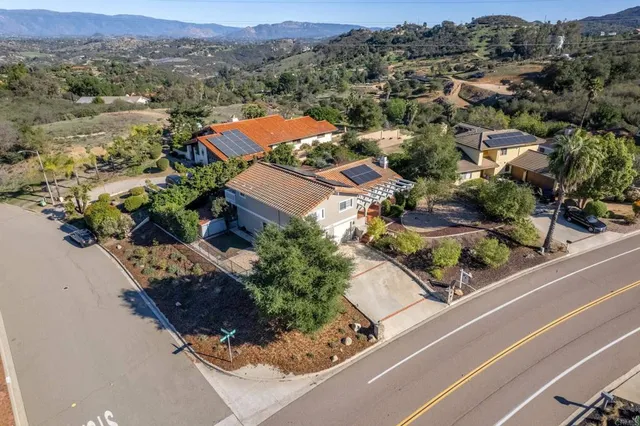 an aerial view of a house with a garden