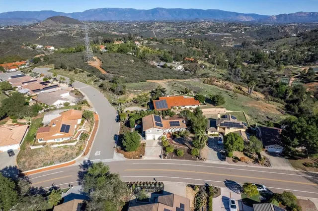 an aerial view of residential house and sandy dunes