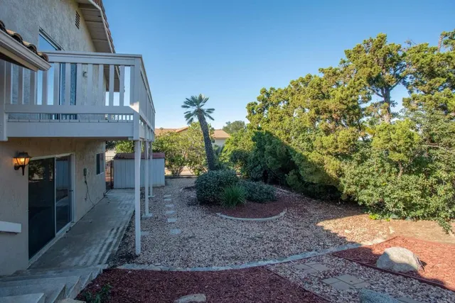 a view of a house with a tree