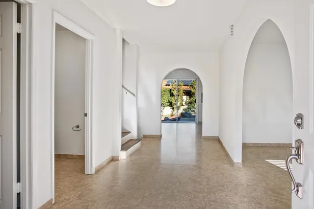 a view of a hallway view with staircase