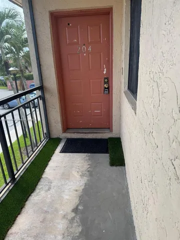 a view of balcony with wooden floor