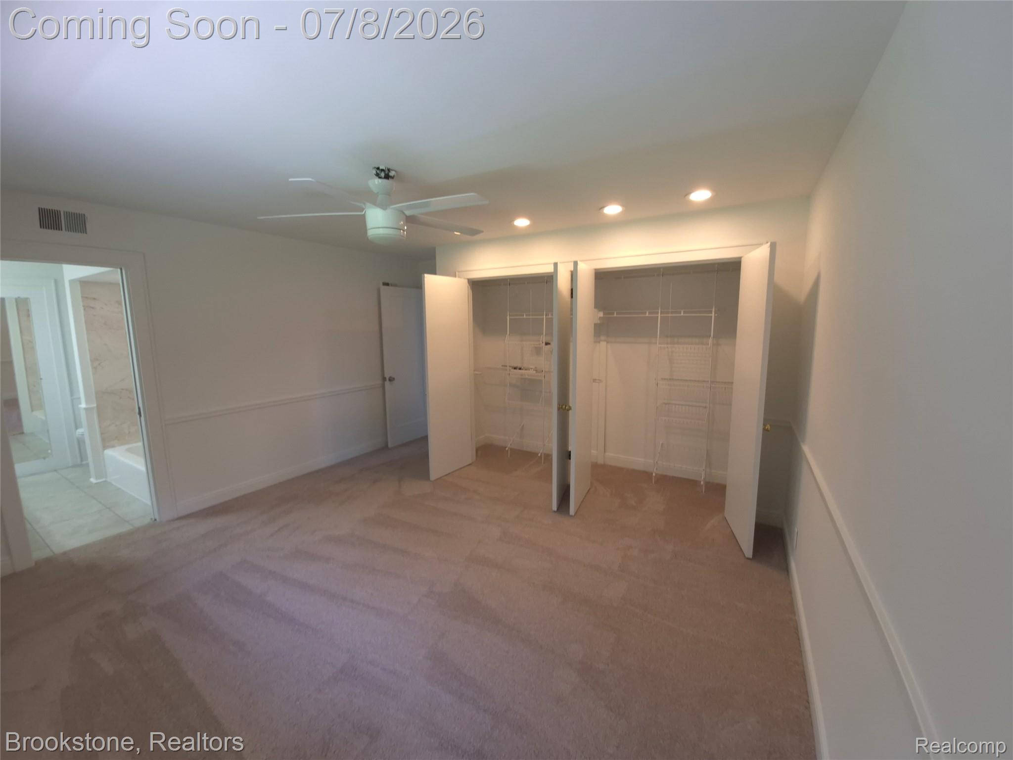 4140 South Henderson Road Davison, MI 48423 - Photo 60 of 98 Carpeted room featuring two built-in closets with wire shelving, recessed lighting, and a ceiling fan
