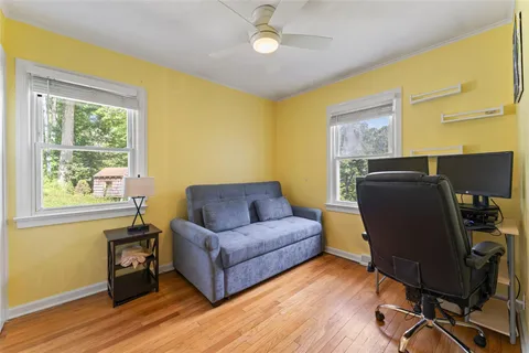 a living room with furniture and a window