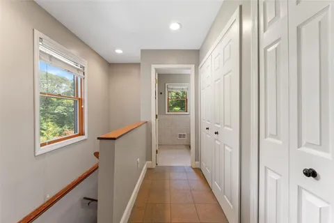 a view of a hallway with windows