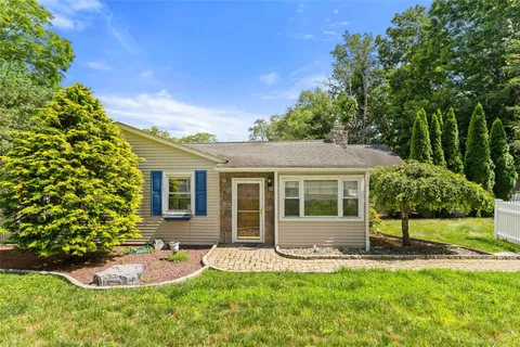front view of a house with a yard