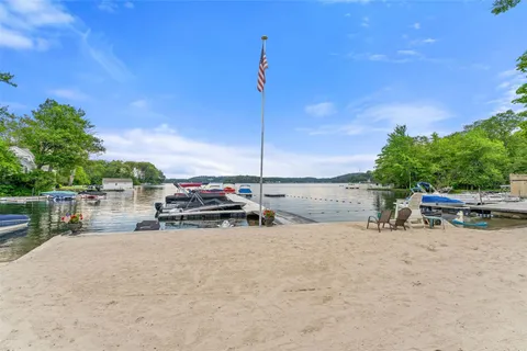 a view of backyard with a car parked