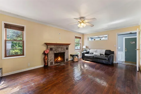a living room with furniture and a fireplace