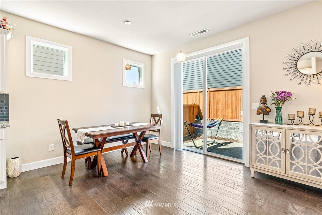 3919 176th Street Southeast Bothell, WA 98012 - Photo 14 of 31 a dining room with furniture window and wooden floor