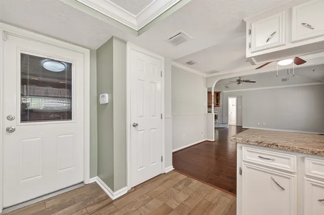 a view of a kitchen from the hallway