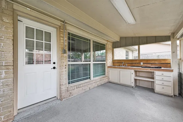 a view of open kitchen with granite countertop a stove top oven