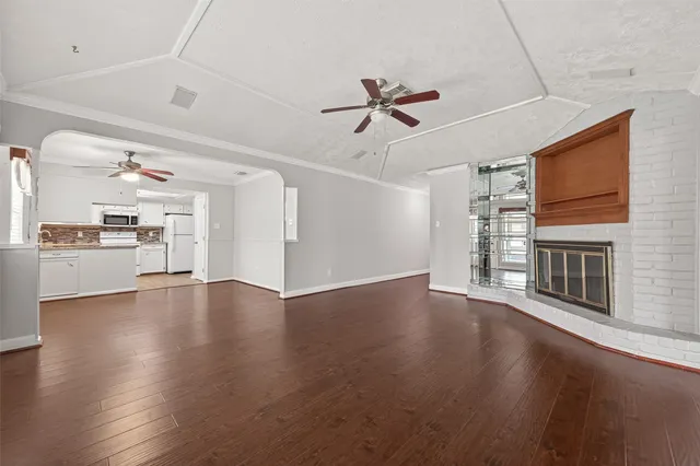 a view of a kitchen with a dishwasher a kitchen wooden floor and a kitchen