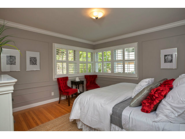 406 Edgewood Road San Mateo, CA 94402 - Photo 13 of 24 a bedroom with a bed and wooden floor