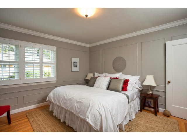 406 Edgewood Road San Mateo, CA 94402 - Photo 14 of 24 a bedroom with a bed and a large window