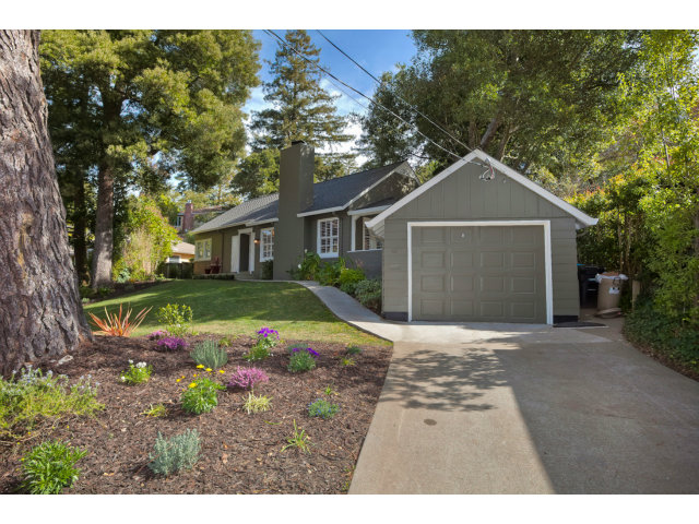 406 Edgewood Road San Mateo, CA 94402 - Photo 4 of 24 a view of a white house with a yard and potted plants