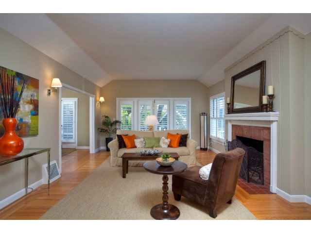 406 Edgewood Road San Mateo, CA 94402 - Photo 5 of 24 a living room with furniture a fireplace and a large window