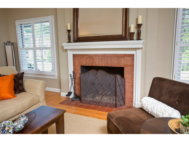 406 Edgewood Road San Mateo, CA 94402 - Photo 7 of 24 a living room with furniture and a fireplace