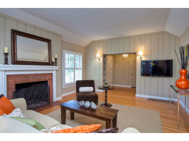 406 Edgewood Road San Mateo, CA 94402 - Photo 9 of 24 a living room with furniture and a fireplace