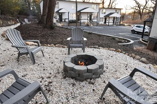 a view of a backyard with sitting area