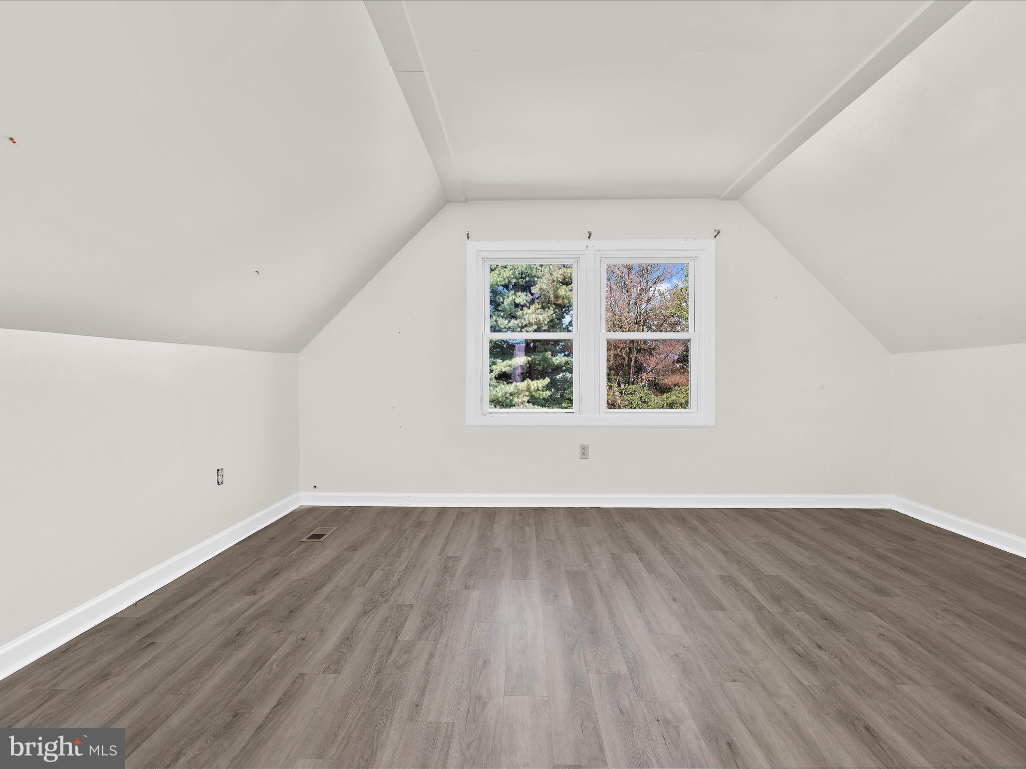 812 Roe Road Barclay, MD 21607 - Photo 15 of 46 an empty room with wooden floor and windows
