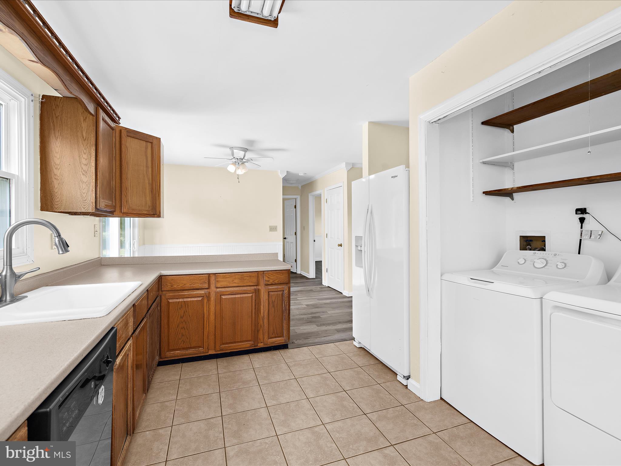 812 Roe Road Barclay, MD 21607 - Photo 27 of 46 a large kitchen with a sink refrigerator and cabinets