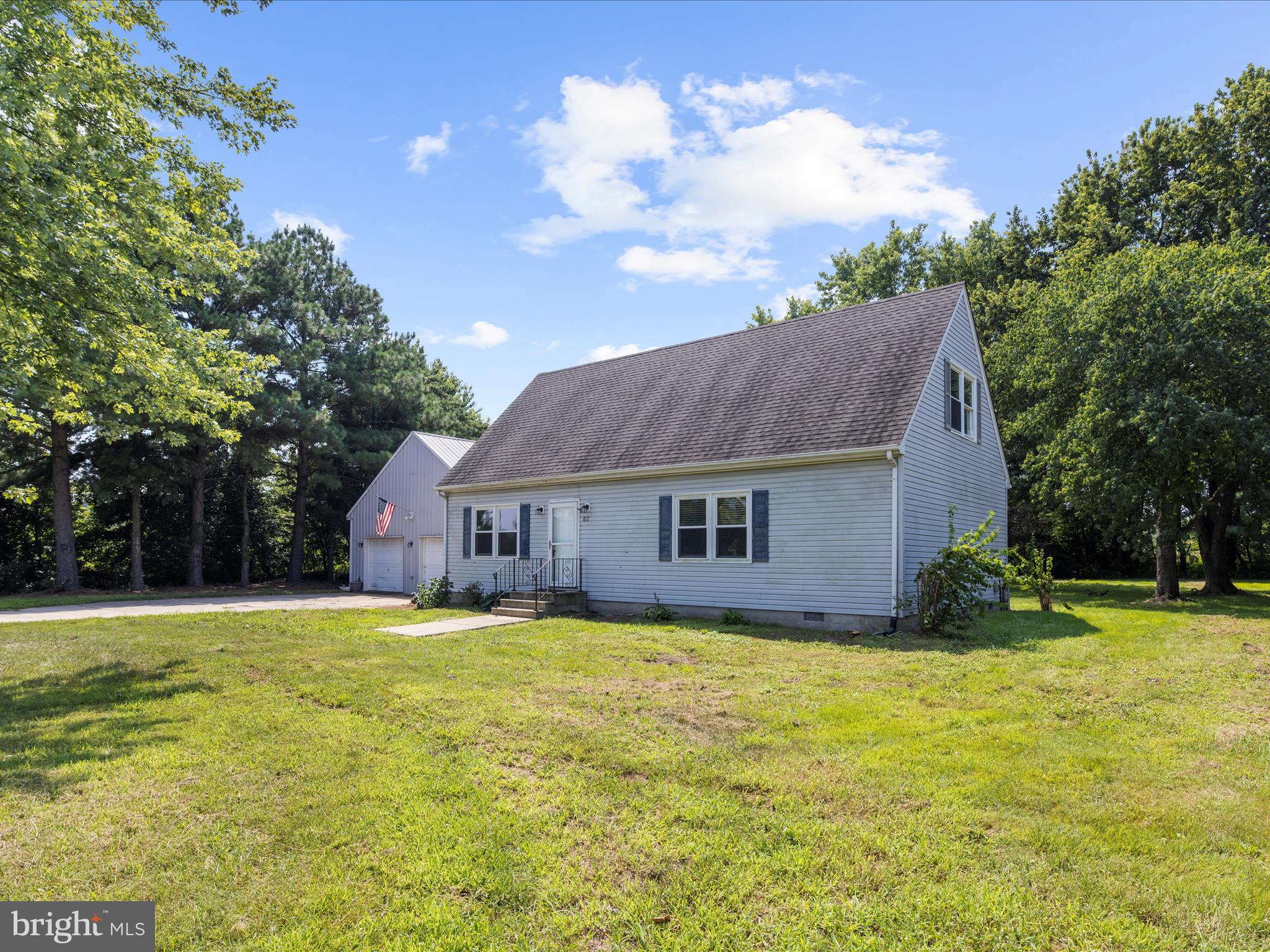 812 Roe Road Barclay, MD 21607 - Photo 4 of 46 a house that has a big yard with large trees
