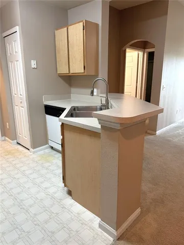a utility room with a sink a washer and dryer