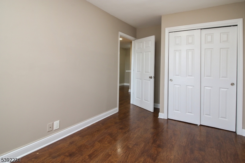 39 East 39th Street Paterson, NJ 07514 - Photo 12 of 15 a view of an empty room with wooden floor