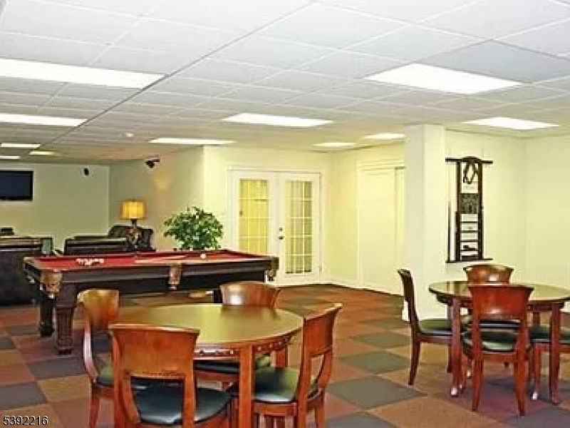 39 East 39th Street Paterson, NJ 07514 - Photo 4 of 15 a view of a dining room with furniture and wooden floor