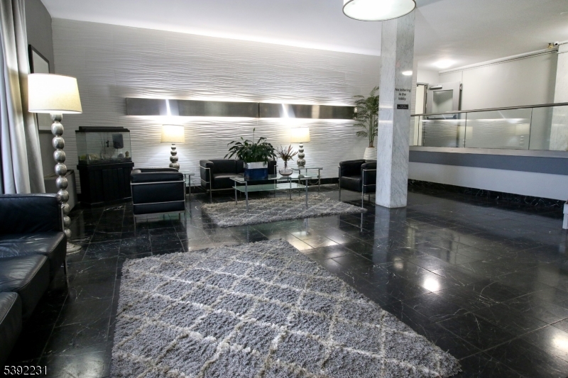 39 East 39th Street Paterson, NJ 07514 - Photo 7 of 15 a bathroom with a sink and a large mirror